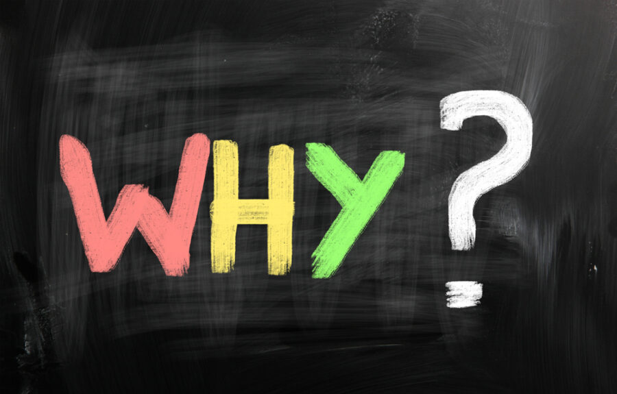 "Why?" written on chalkboard