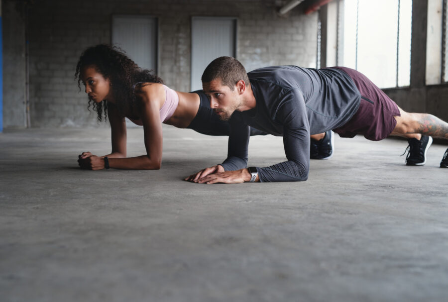 Man and woman doing planks together