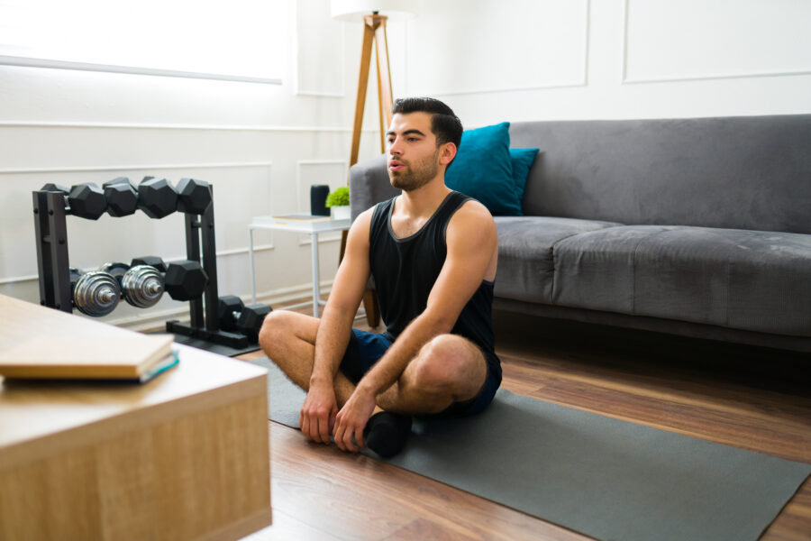 Man stretching at home
