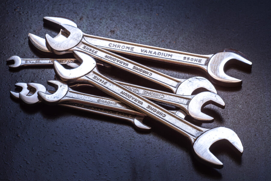 Wrenches on black background