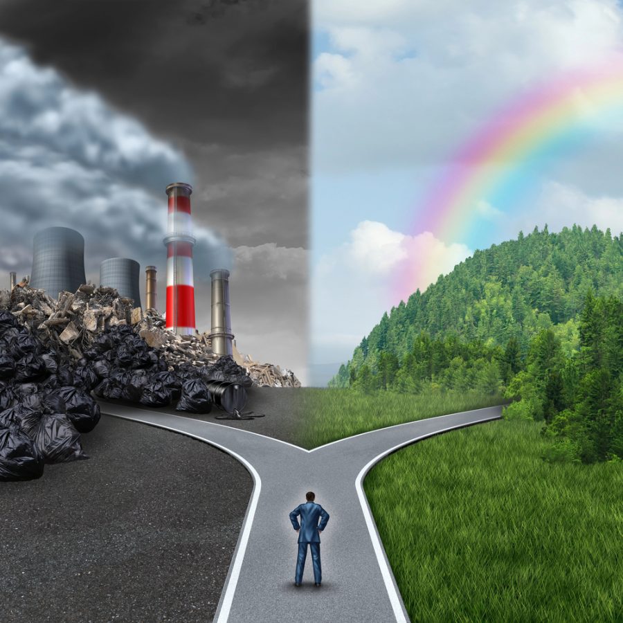 Man at fork in the road one showing pollution and factories and the other showing a rainbow and nature