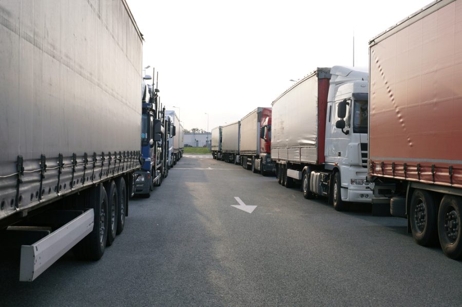 Crowded truck parking lot. Drivers try to park so as to take up