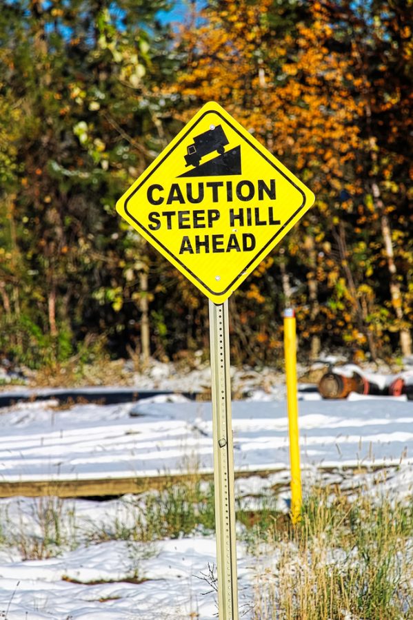 caution steep hill sign