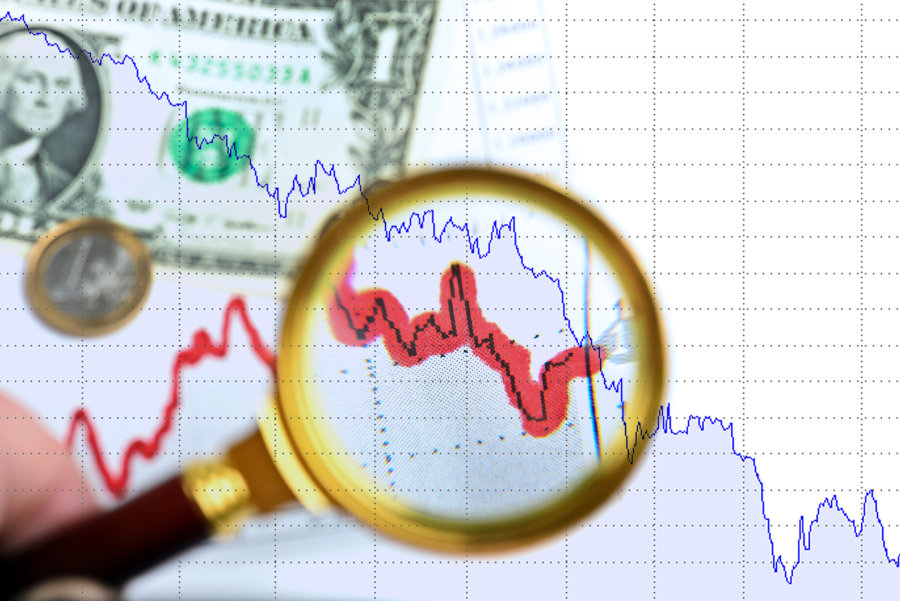 magnifying glass on charts