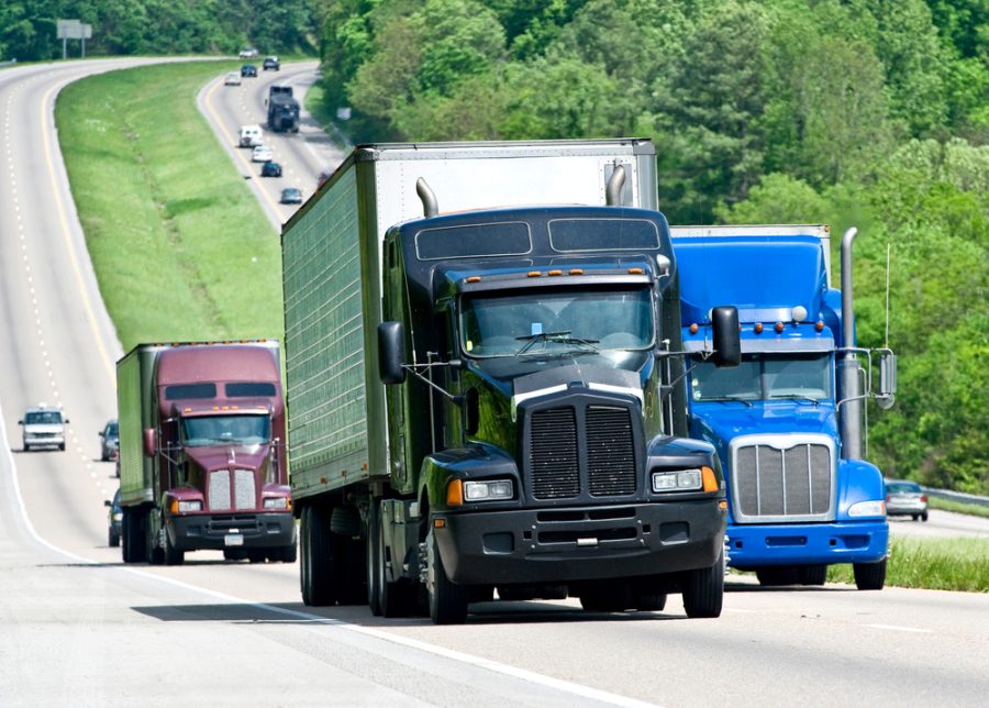 trucks driving down highway