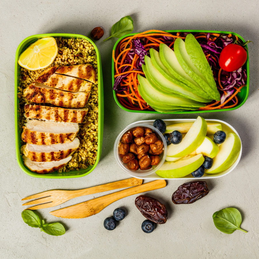 Meal prep of chicken, fruit, and vegetables