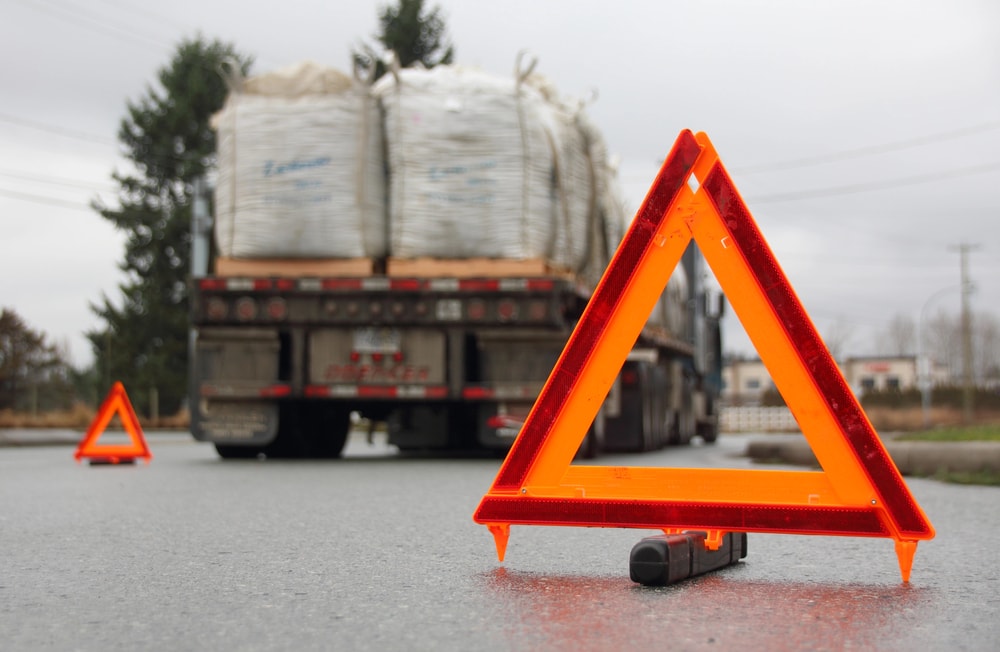 Reflective triangles in front of flatbed trailer