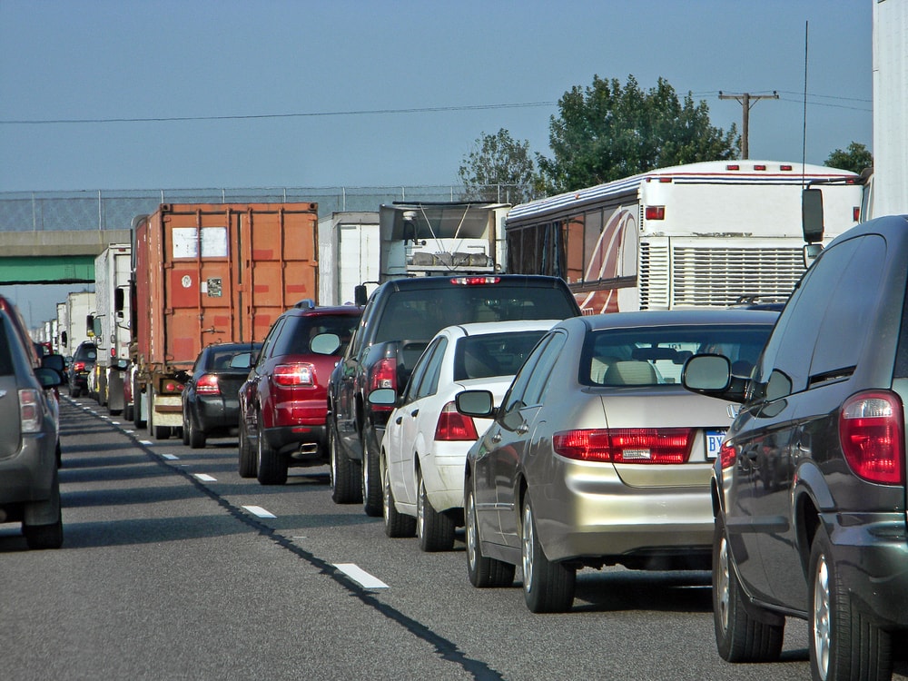 trucks and cars in rush hour traffic