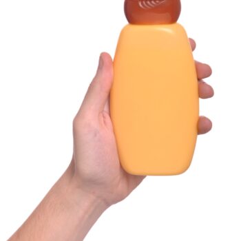 Hand Holding Sun Lotion