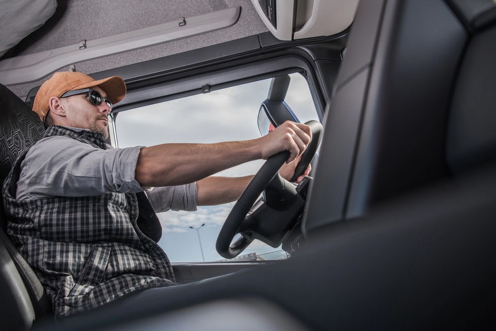 truck driver holding a steering wheel