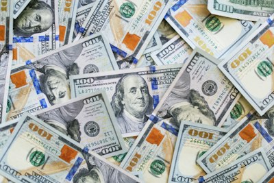 pile of hundred dollar bills